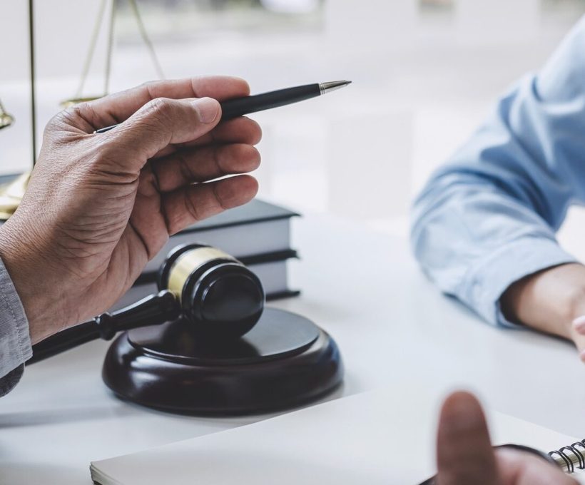 consultation-and-conference-of-male-lawyers-and-professional-businesswoman-working-and-discussion.jpg